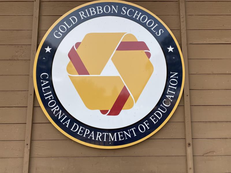 gold ribbon school seal sign
